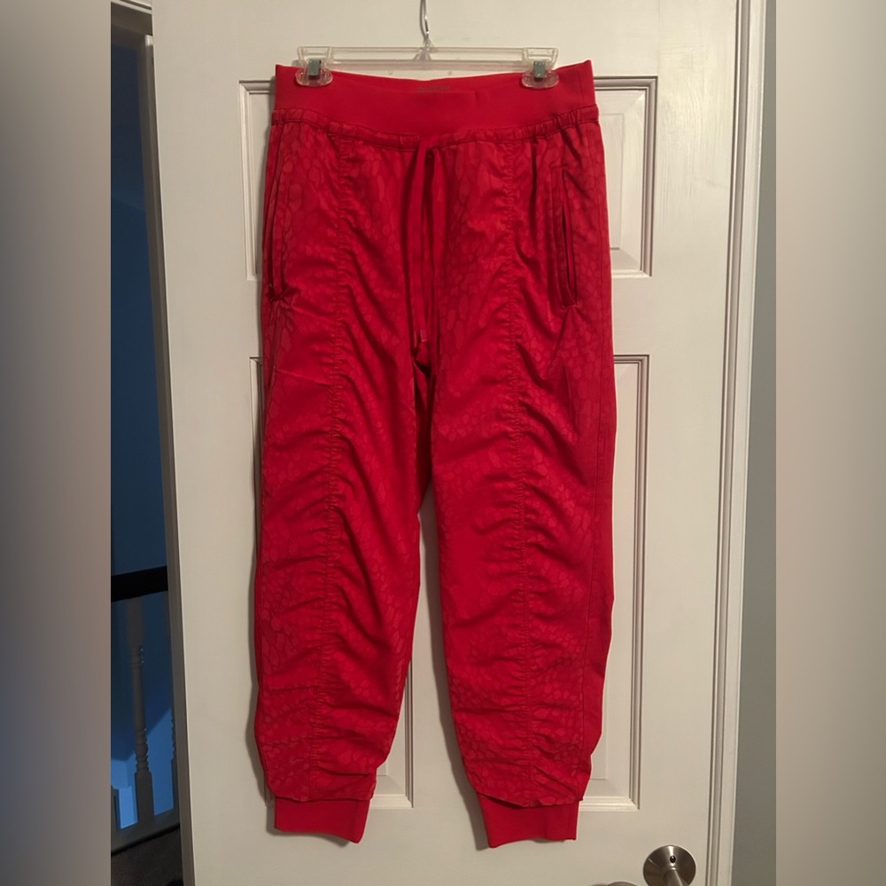 Athleta joggers. Red “animal” print. Size 8